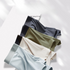 Premium men's boxer briefs collection in various colors - black, olive green, cream and light gray - showcasing quality fabric
