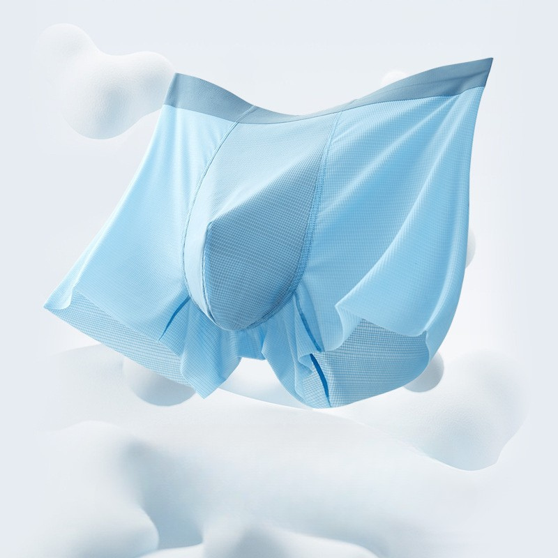 Floating light blue men's boxer briefs showcasing lightweight breathable fabric construction