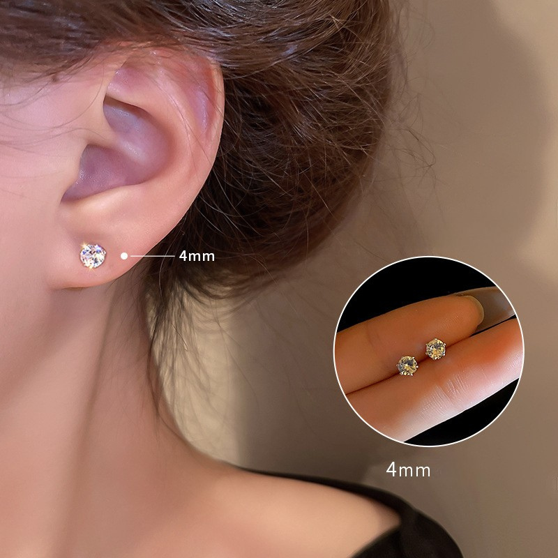 Cubic zirconia earrings showing size progression on ear