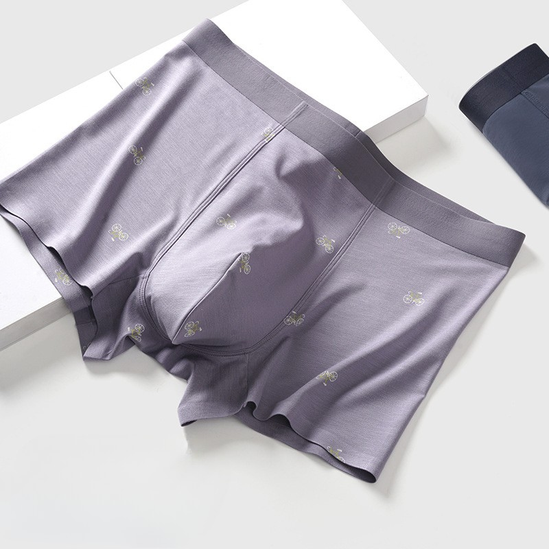 Gray men's boxer briefs on display with bicycle motif pattern and elastic waistband