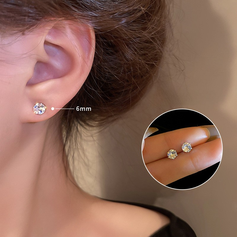Cubic zirconia earrings showing size progression on ear