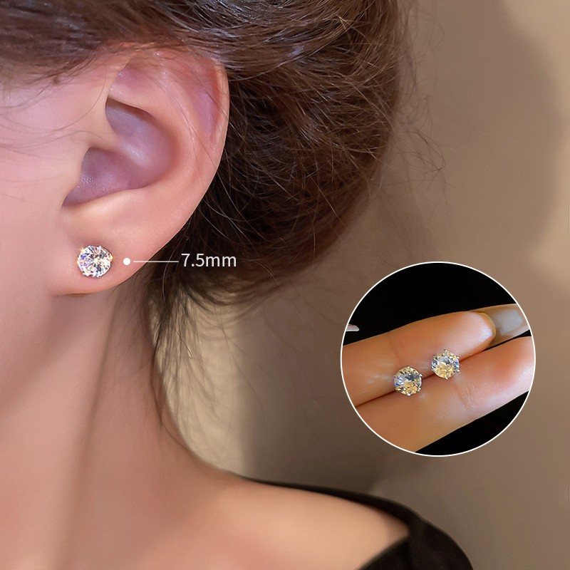 Cubic zirconia earrings showing size progression on ear