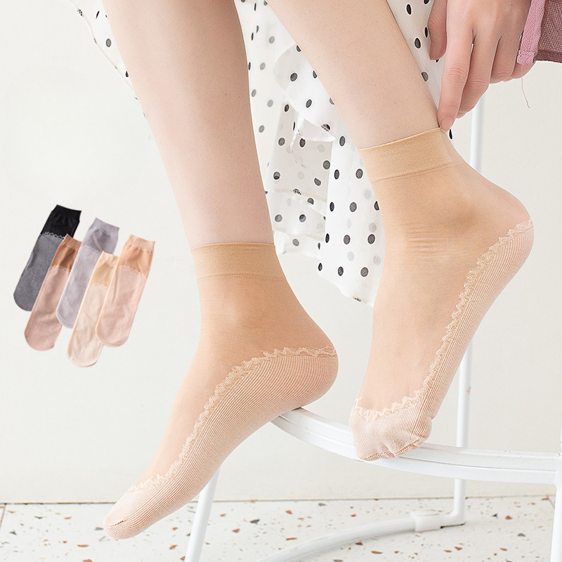 Sheer ankle socks in beige with decorative ribbed sole, shown with color options in black and grey
