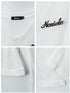 Close-up details of white ribbed knit fabric, raw-edge seams, and embroidered logo.