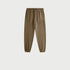 Close-up of olive green joggers with elastic waistband and drawstring against white background