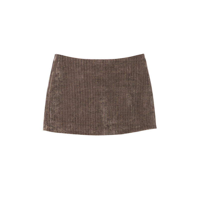 Brown ribbed corduroy mini skirt with subtle A-line shape, displayed flat on white background.