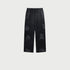 Black drawstring pants displayed flat with elasticized waistband and textured wash pattern. Shows relaxed straight-leg design