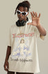 Man in angel tee poses with hands raised wearing headphones and chain