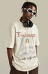 Man wearing angel tee gestures with hand forward, styled with headphones and sunglasses