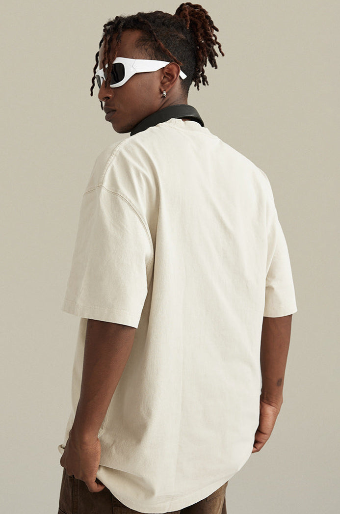 Side view of man wearing angel tee and white sunglasses