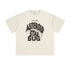 Flat lay of cream T-shirt with dripping “ASTEROID STAR BUG” print in grunge font.