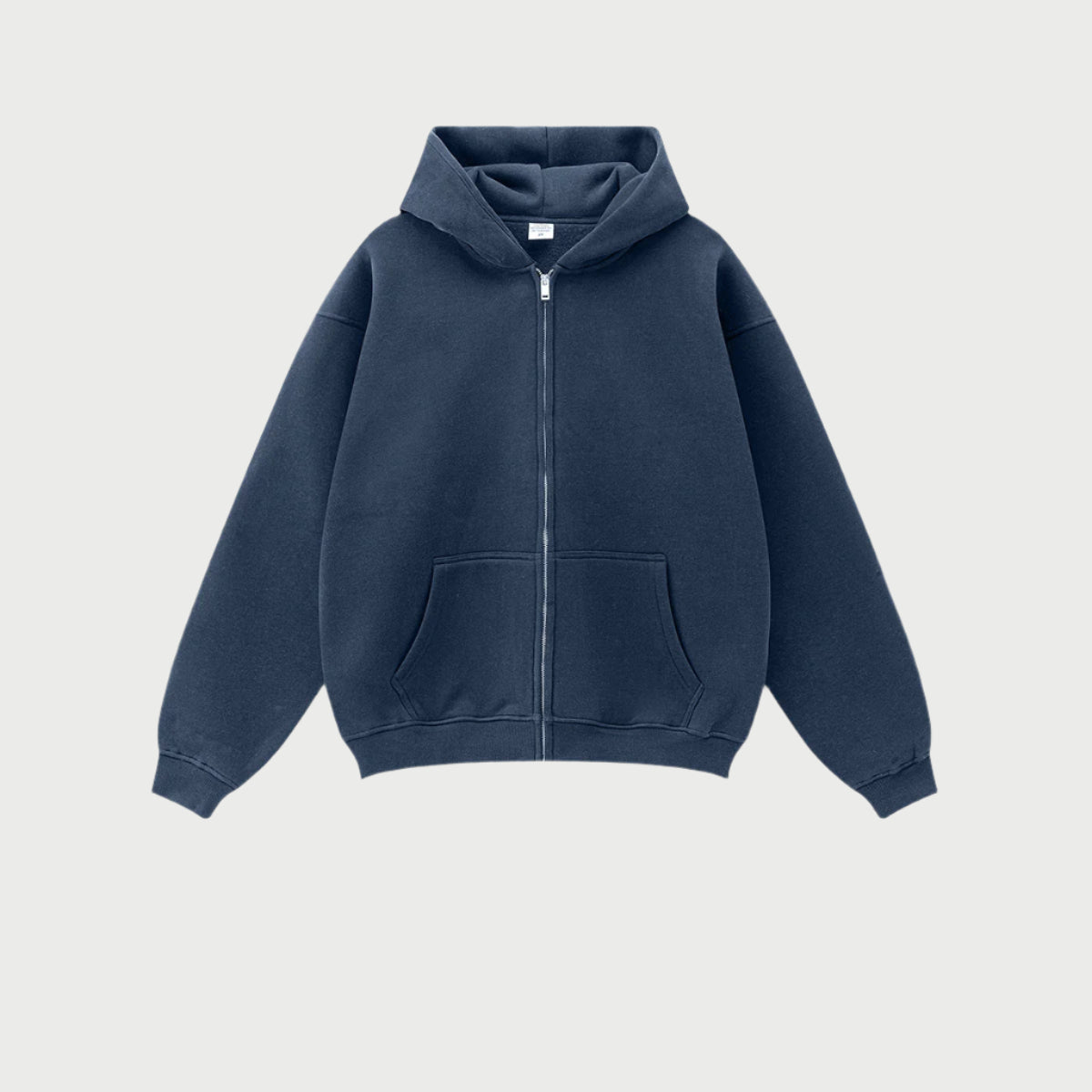 Navy blue oversized zip-up hoodie with front kangaroo pocket and ribbed cuffs displayed on light gray background
