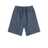 Navy blue cotton shorts with elastic waistband and drawstrings, featuring relaxed fit and side pockets, displayed flat