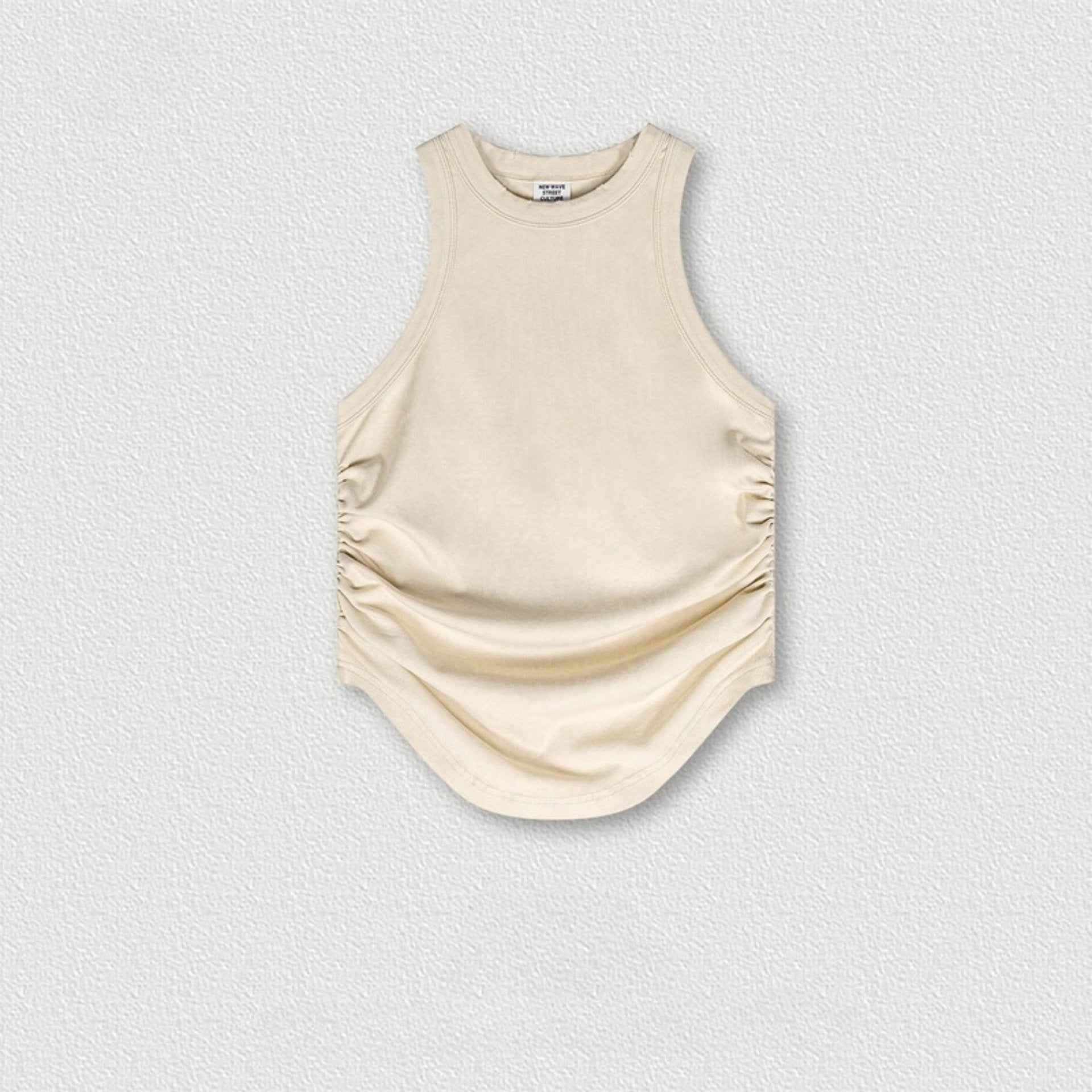Off-white sleeveless top with ruched sides and curved hem, flat product shot