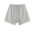 Heather gray cotton shorts with elastic waistband and drawstring, displayed flat against white background