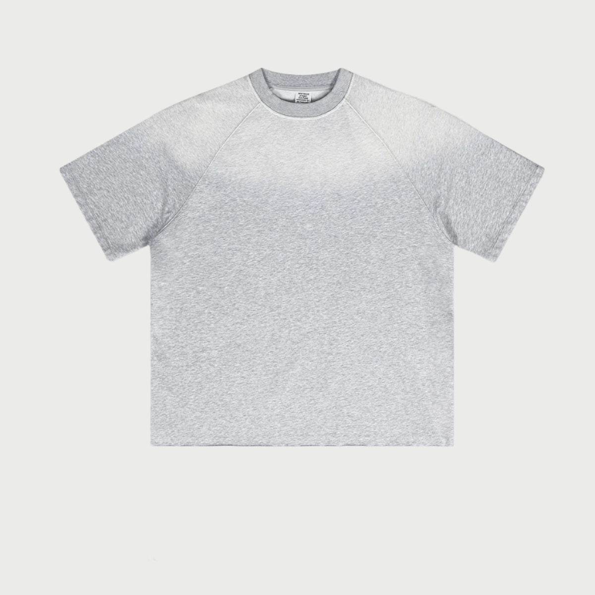 Light heather gray oversized t-shirt with raglan sleeves displayed flat against light gray background