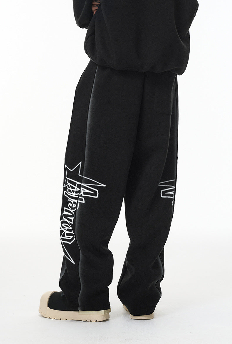 Rear three-quarter view—relaxed fit black sweatpants with roomy thigh and seat.