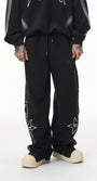 Black baggy sweatpants, wide-leg straight hem, mid-rise drawstring, front view.