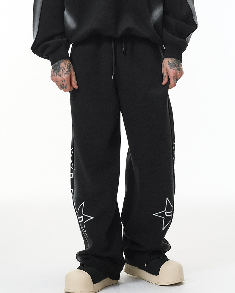 Black baggy sweatpants, wide-leg straight hem, mid-rise drawstring, front view.