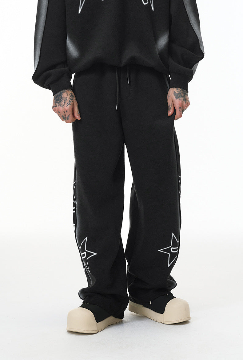 Black baggy sweatpants, wide-leg straight hem, mid-rise drawstring, front view.