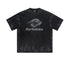 Oversized black Backstairs t-shirt with distressed logo graphic and paint-splatter effect against white background