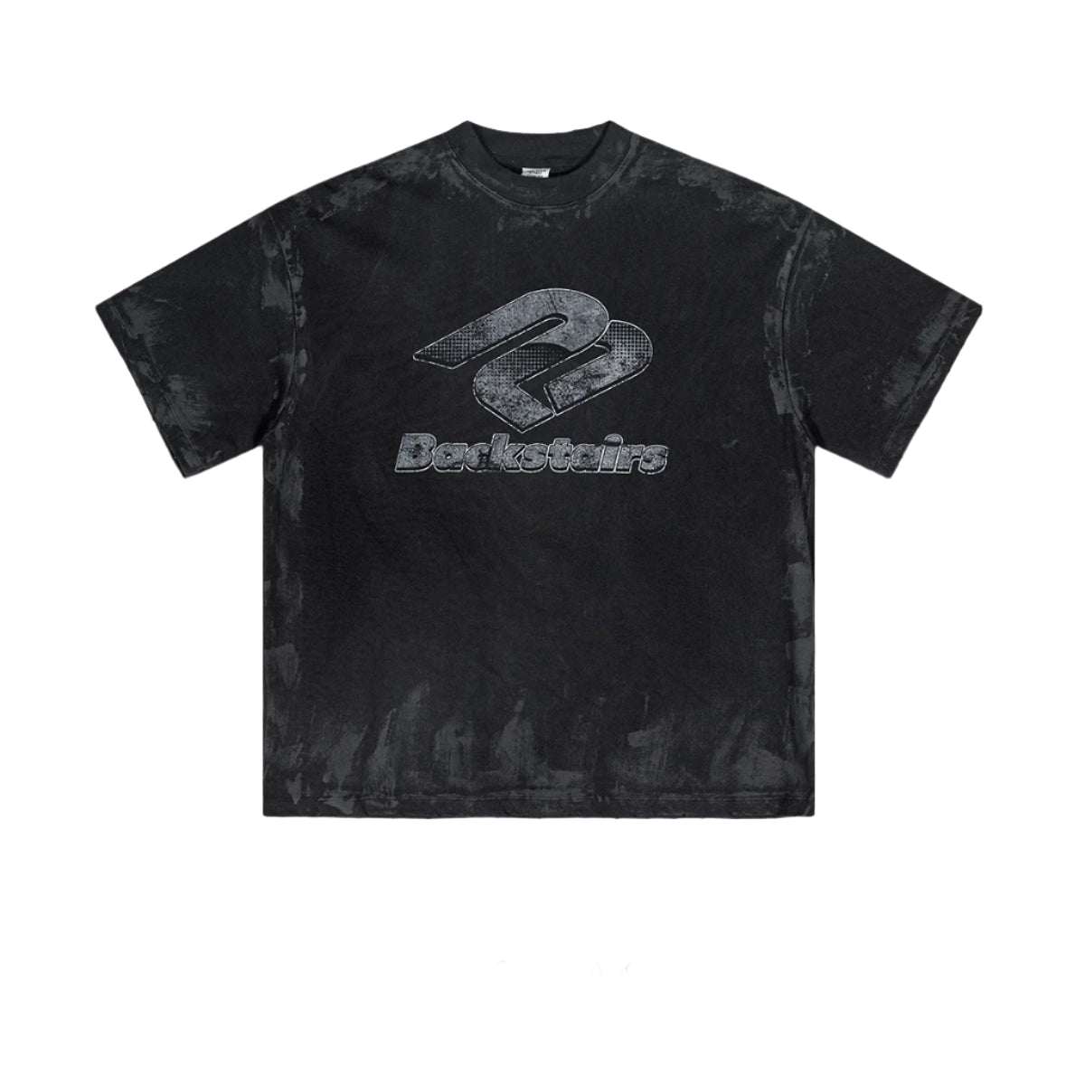 Oversized black Backstairs t-shirt with distressed logo graphic and paint-splatter effect against white background