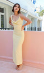 Beige cowl neck midi dress with slim fit and high waist, styled for wedding guest or event look.