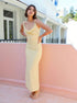 Beige cowl neck midi dress with slim fit and high waist, styled for wedding guest or event look.