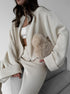 Side view of beige knit lounge set with wide leg pants