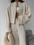 Beige knit lounge set styled with soft plush bag