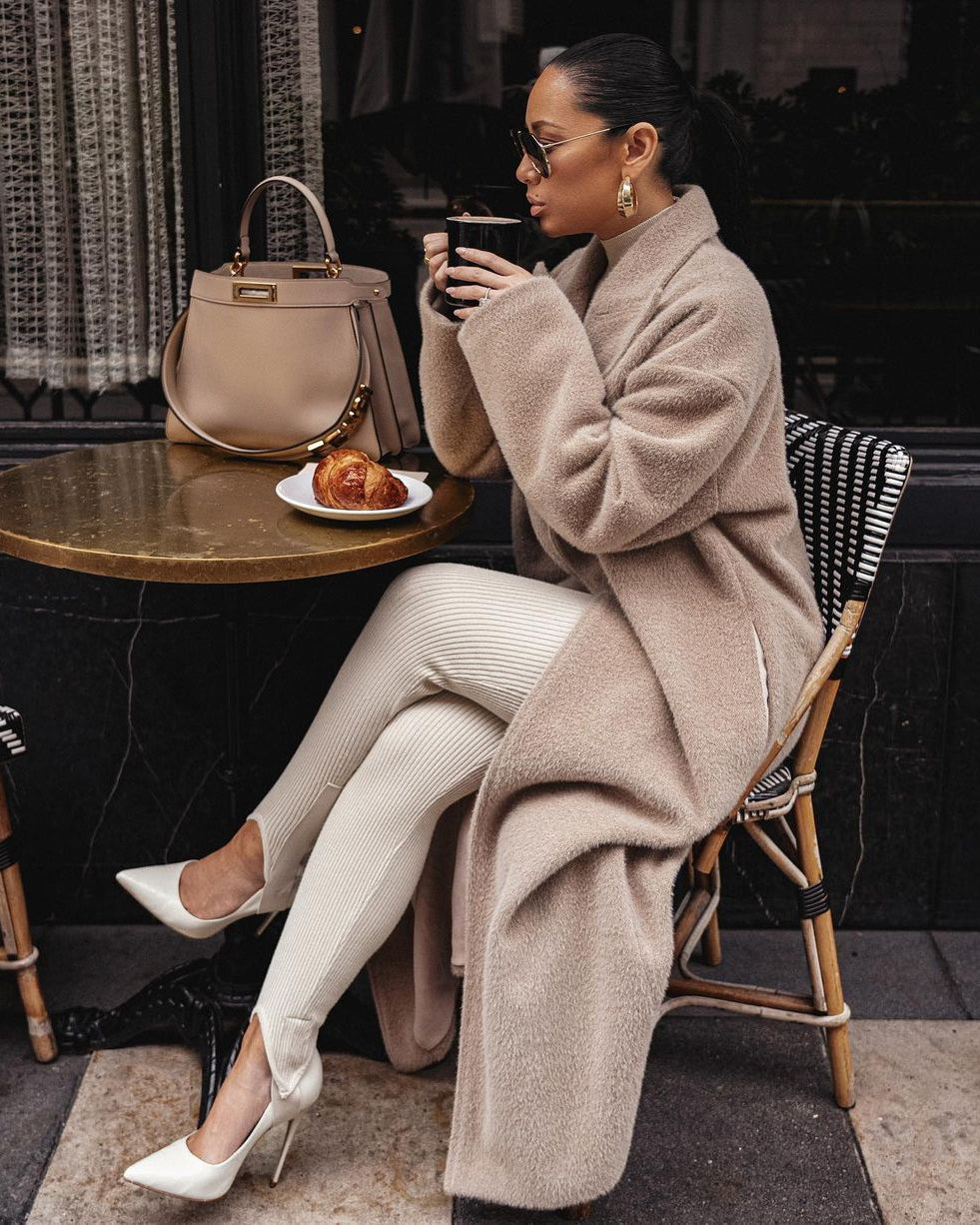Beige long teddy coat, café seating, soft winter layering
