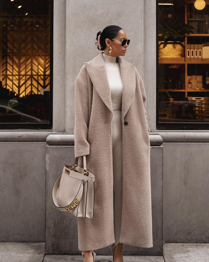 Beige teddy lapel coat, hands in pockets, front street view