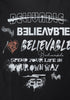 Close-up of full graphic print on black T-shirt featuring layered 'Believable' typography and slogans.