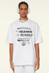 Model facing forward in white oversized tee with layered 'Believable' typography print.