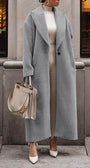 Woman in long gray teddy lapel coat, slim fit—best winter coats street look