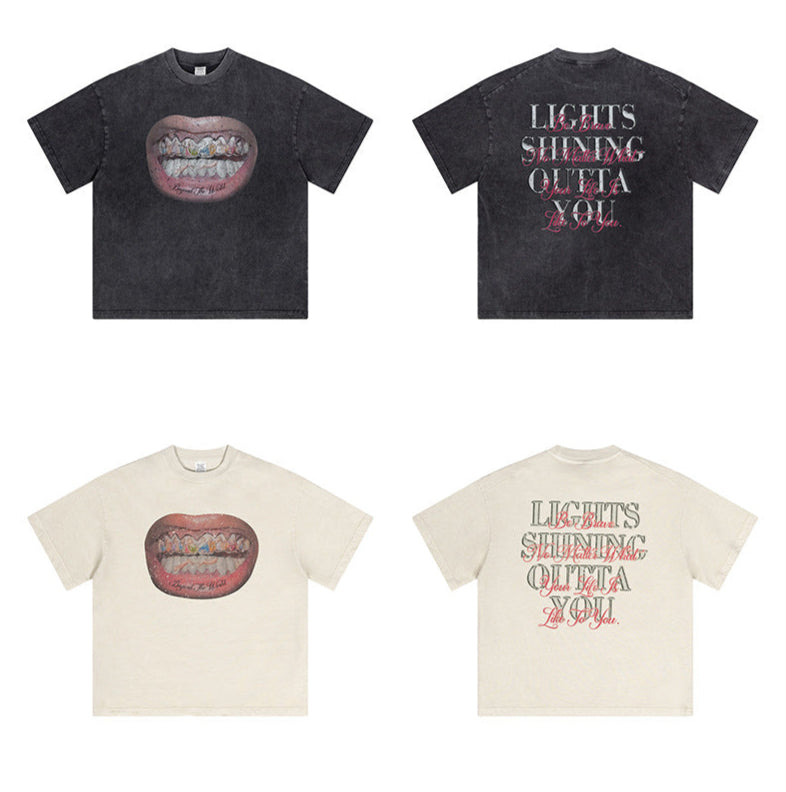 Flat lay of black and off-white graphic tees showing front and back designs.
