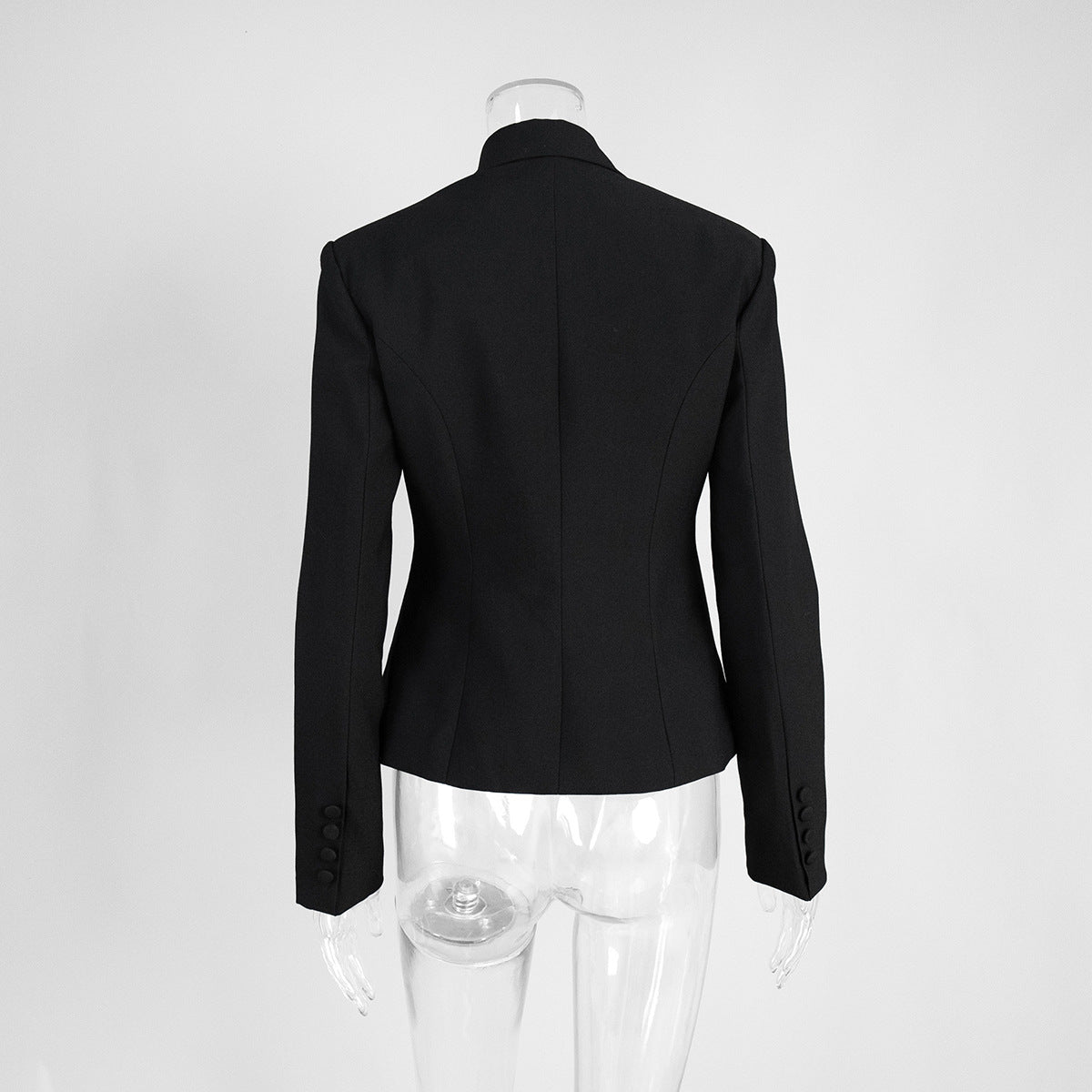 Back view of black blazer showing fitted silhouette