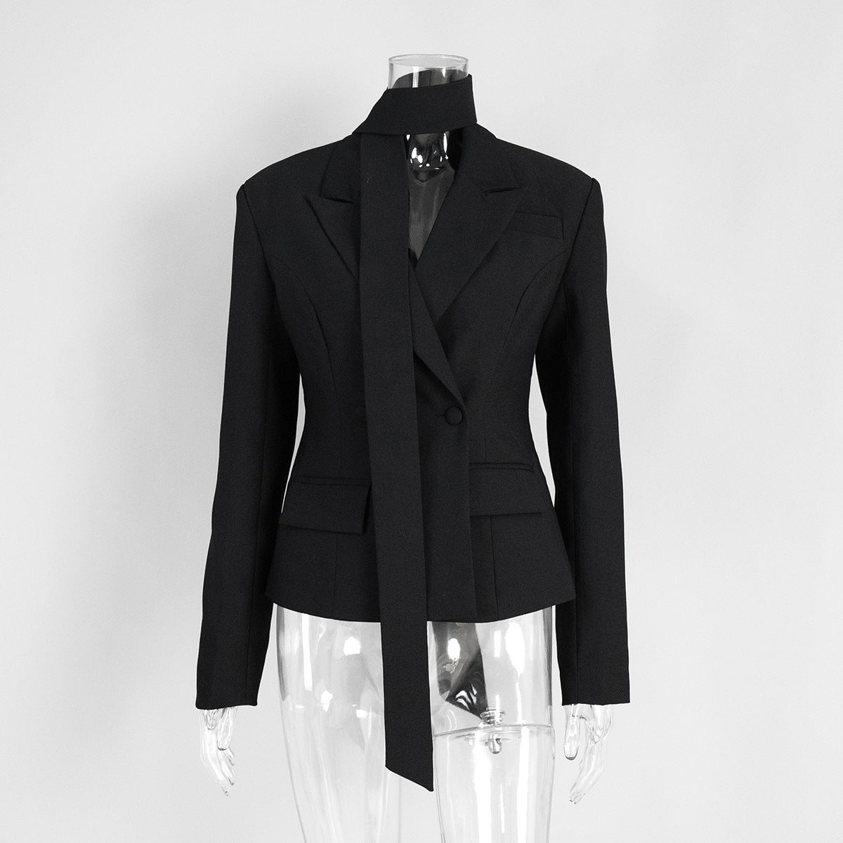 Black tailored blazer displayed on hanger front view