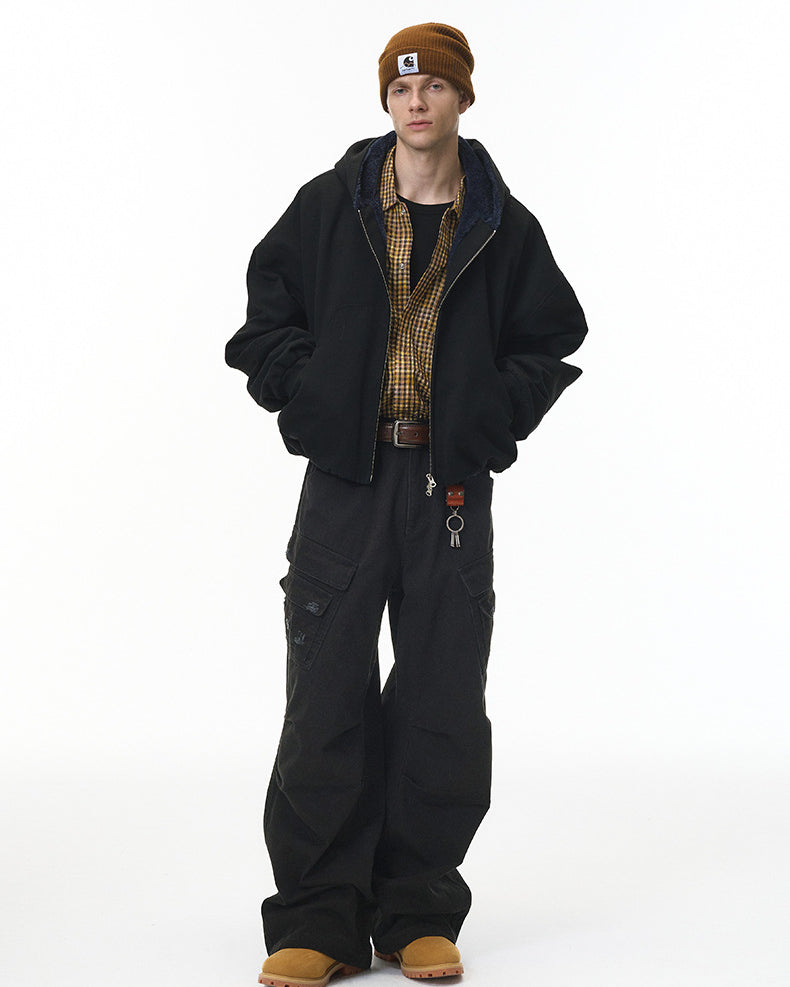 Black cargo pants full body on model with jacket, relaxed street fit
