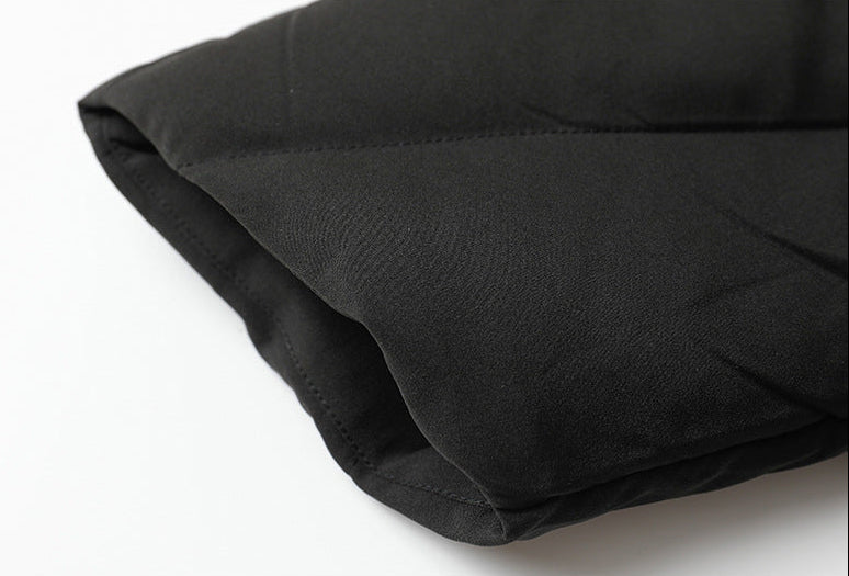 Cuff stitching detail on women’s black down jacket