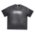 Black oversized tee with white motivational quote text, displayed on textured background.