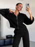 Black knit lounge set styled with wide leg pants