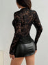 back view black lace top, sheer mesh floral pattern, slim fit, paired with leather mini skirt