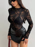 three-quarter view black lace long sleeve top over bralette, leather mini skirt, night-out styling