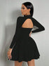 Side view of black long sleeve mini dress with square neck, A-line skirt, and open back detail.