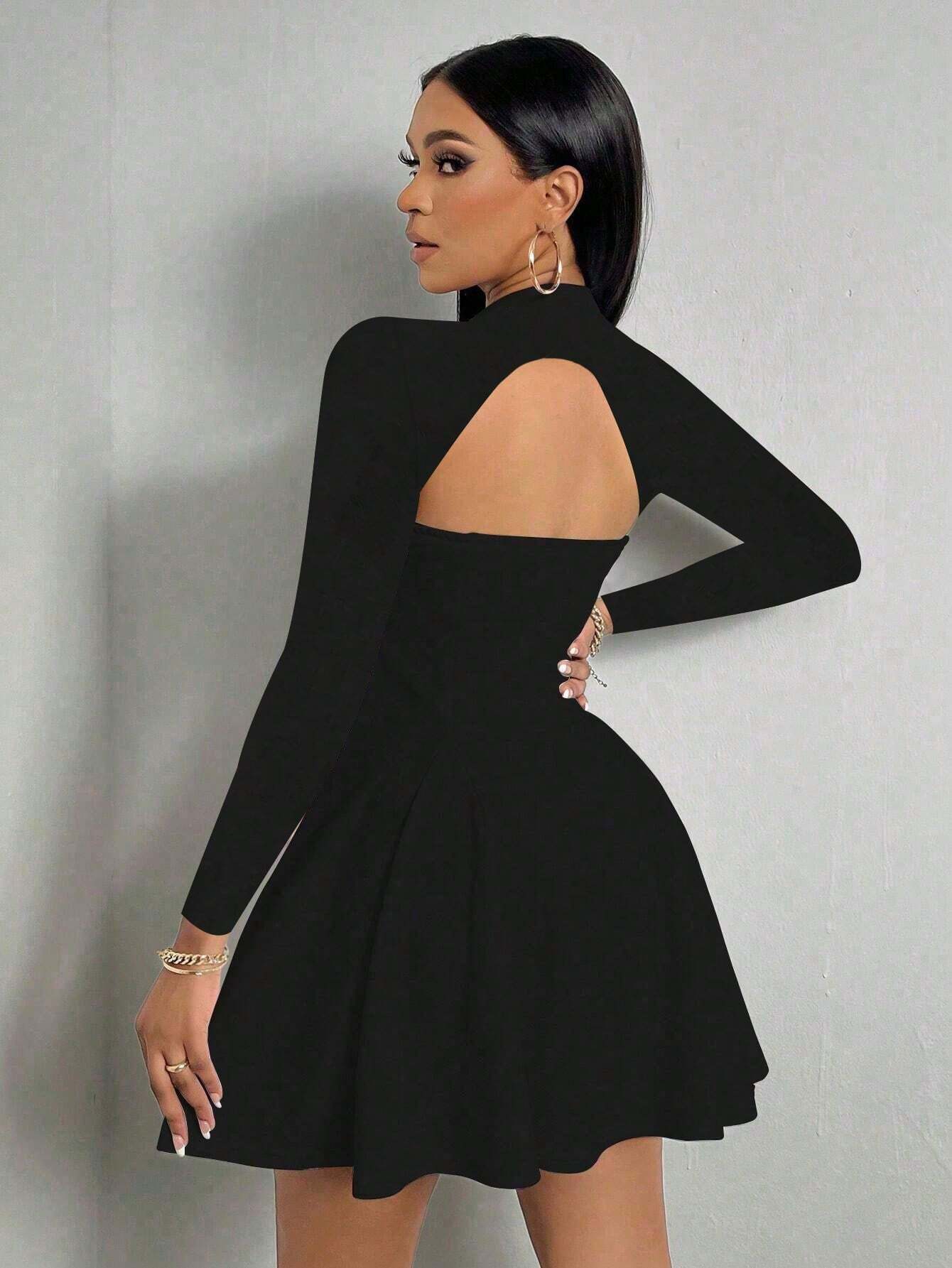 Side view of black long sleeve mini dress with square neck, A-line skirt, and open back detail.