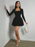 Black long sleeve mini dress with square neck and A-line skirt in full-body walking view.