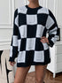 black mock neck sweater with oversized checkered pattern styled indoors