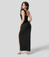 Back view of black one-shoulder maxi dress with waist cut-out and long straight skirt.