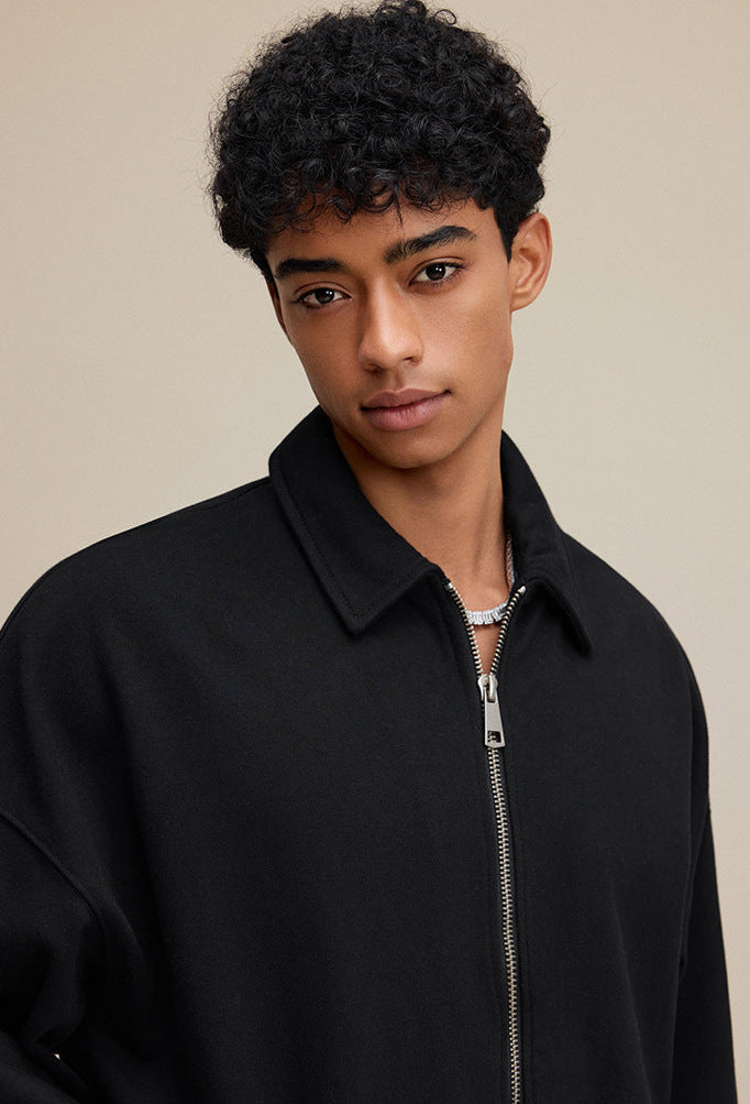 Close-up of black polo zip up collar and zipper